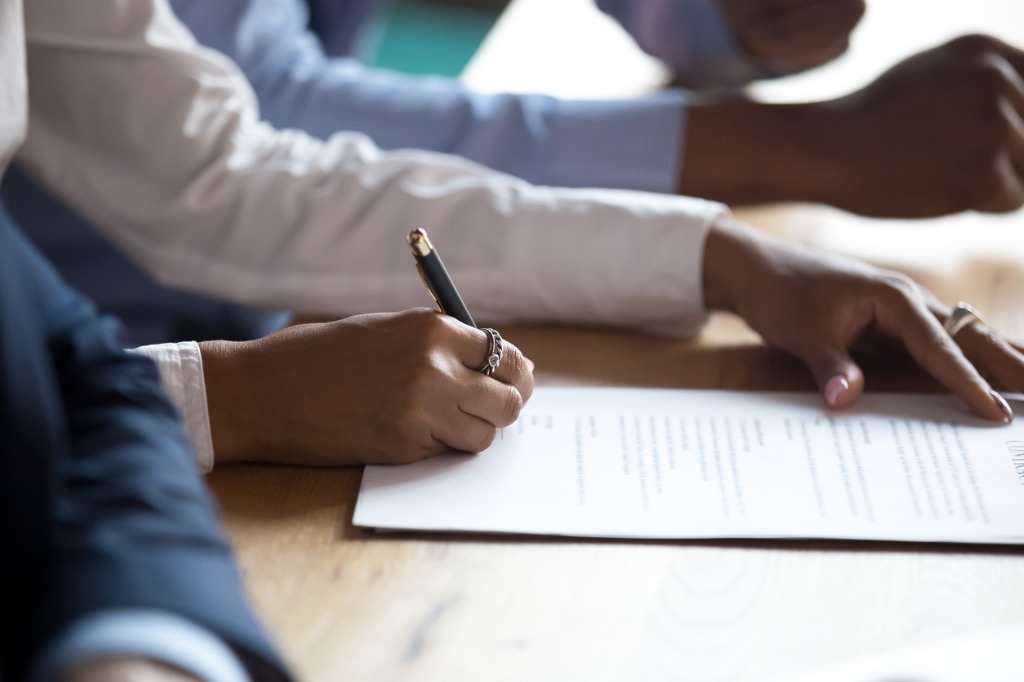 Hands Sign Business Contract at Meeting @istockphoto.com/fizkes
