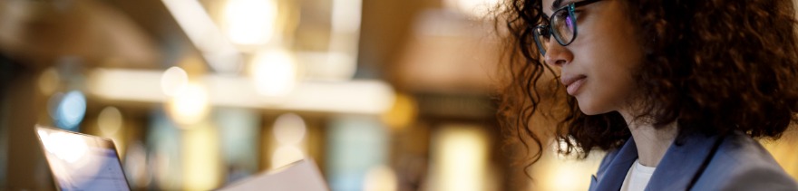 Businesswoman working on laptop at a cafe ©iStockphoto.com/damircudic