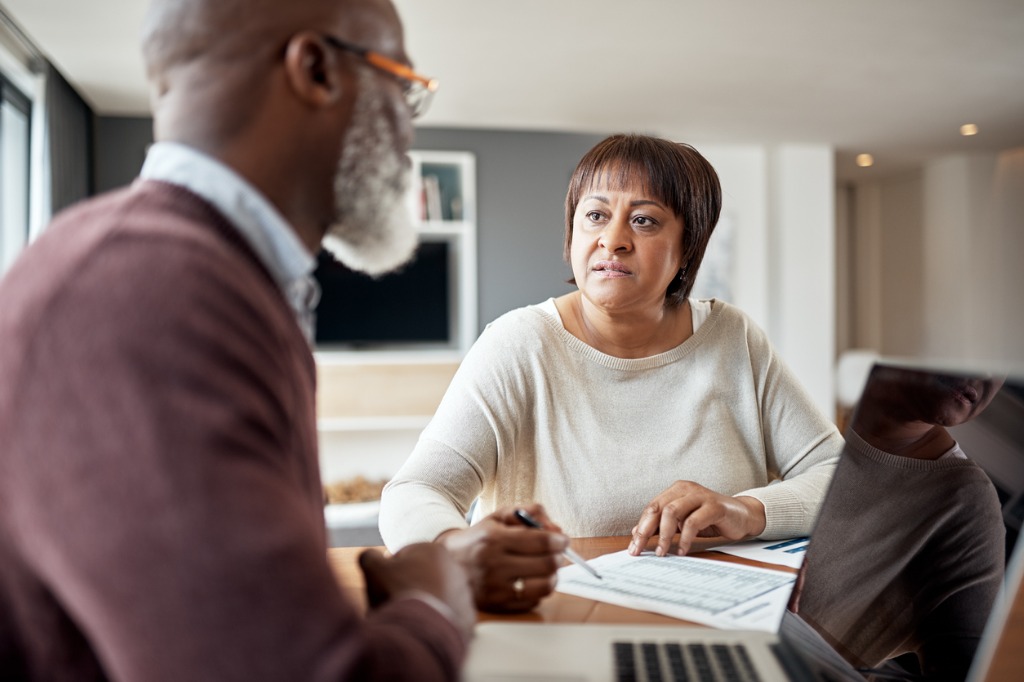 Senior Couple Reviewing Financial Documents at Home